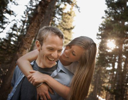 A nicotine-free couple playing in a forest