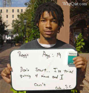 College student holds sign declaring addicted to smoking nicotine